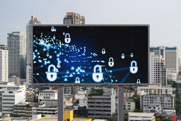 Holograma de ícone de cadeado em outdoor de estrada sobre vista panorâmica da cidade de bangkok durante o dia para proteger negócios sudeste asiático o conceito de escudos de segurança da informação