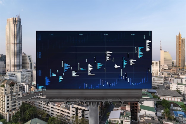 Holograma de Forex y gráficos bursátiles en la cartelera de la carretera sobre la vista panorámica de la ciudad de Bangkok El centro financiero en el sudeste asiático El concepto de comercio internacional