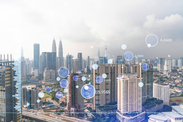 Holograma de Forex y gráficos bursátiles sobre la vista panorámica de la ciudad de Kuala Lumpur KL es el centro financiero en Malasia Asia El concepto de comercio internacional Doble exposición