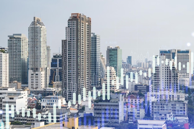 Holograma gráfico de ações financeiras sobre a vista panorâmica da cidade do centro de negócios de Bangkok no sudeste da Ásia O conceito de transações internacionais Dupla exposição