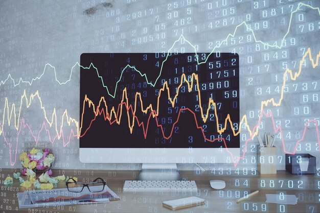 Holograma de gráfico de divisas en la mesa con fondo de computadora Doble exposición Concepto de mercados financieros