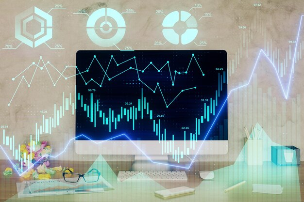 Holograma de gráfico de divisas en la mesa con fondo de computadora Doble exposición Concepto de mercados financieros