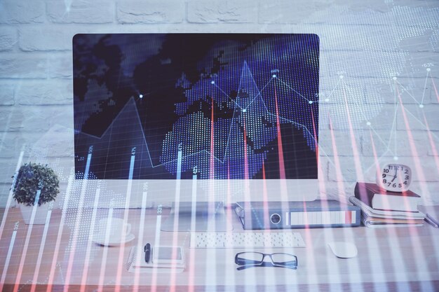 Holograma gráfico de divisas en la mesa con fondo de computadora Doble exposición Concepto de mercados financieros