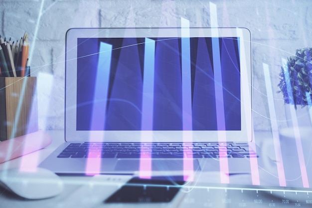 Holograma gráfico de divisas en la mesa con fondo informático Múltiple exposición Concepto de los mercados financieros