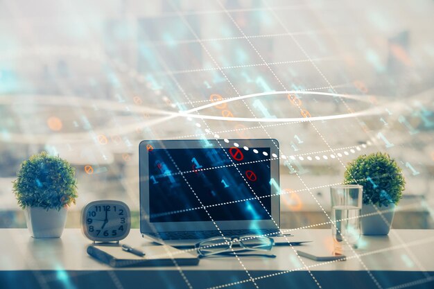 Holograma de gráfico de divisas en la mesa con fondo informático Múltiple exposición Concepto de mercados financieros