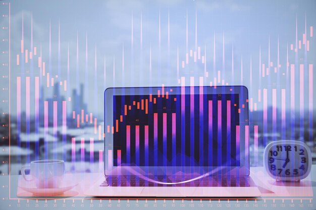 Holograma de gráfico de divisas en la mesa con fondo informático Múltiple exposición Concepto de mercados financieros