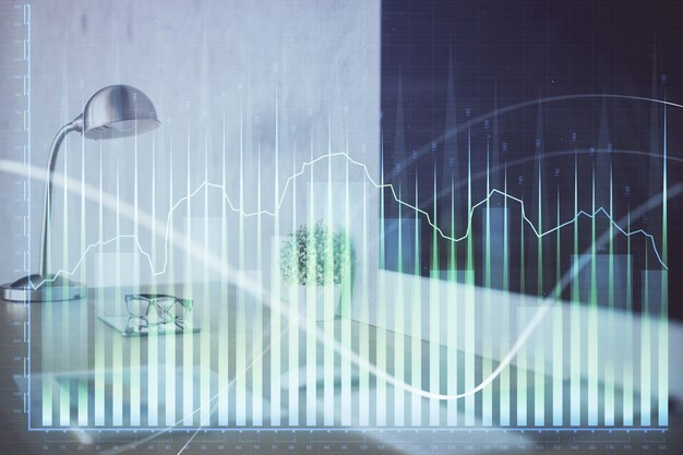 Holograma de gráfico de divisas en la mesa con fondo informático Múltiple exposición Concepto de mercados financieros