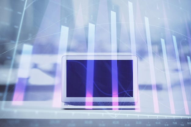 Holograma gráfico de forex en la mesa con fondo de computadora Concepto de exposición múltiple de los mercados financieros