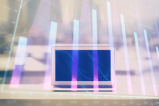 Holograma gráfico de forex en la mesa con fondo de computadora Concepto de exposición múltiple de los mercados financieros