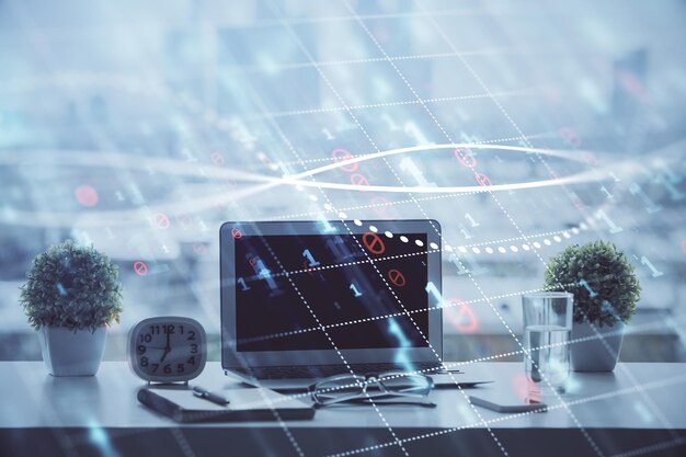 Holograma gráfico de Forex en la mesa con fondo de computadora Concepto de exposición múltiple de los mercados financieros