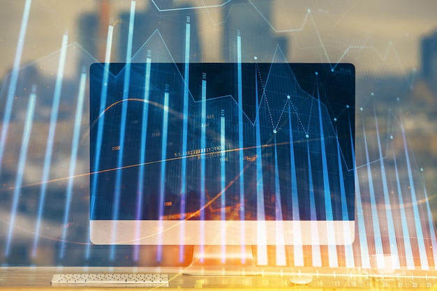 Holograma del gráfico del mercado de divisas y computadora personal en el fondo Doble exposición Concepto de inversión