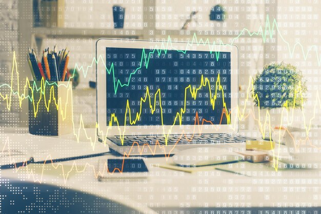 Holograma de gráfico de mercado de divisas y computadora personal en el fondo Exposición múltiple Concepto de inversión