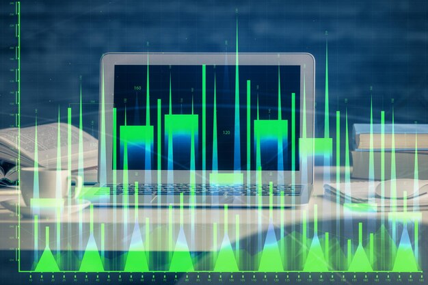 Holograma de gráfico de mercado de divisas y computadora personal en el fondo Exposición múltiple Concepto de inversión