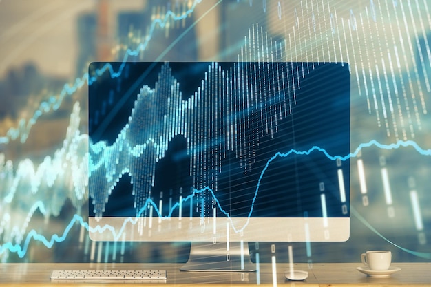 Holograma del gráfico del mercado de divisas y computadora personal en el fondo Exposición múltiple Concepto de inversión