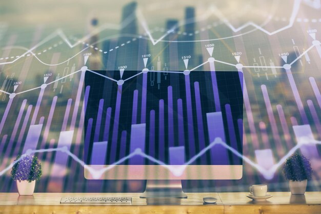 Holograma de gráfico de mercado de divisas y fondo de computadora personal Exposición múltiple Concepto de inversión
