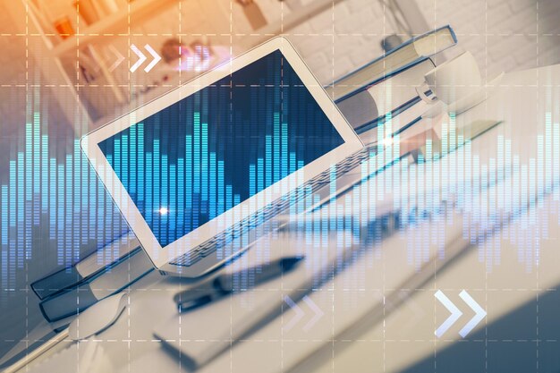 Holograma de gráfico de mercado de divisas y fondo de computadora personal Exposición múltiple Concepto de inversión
