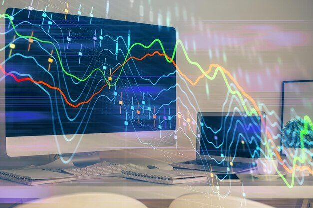 Holograma de gráfico de mercado de divisas y fondo de computadora personal Exposición múltiple Concepto de inversión