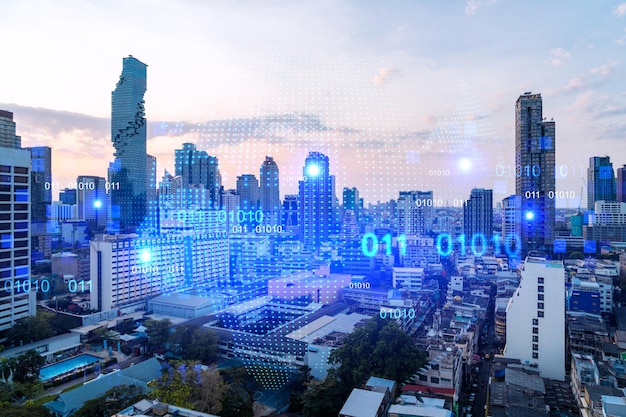 Holograma resplandeciente del mapa del planeta Tierra en el paisaje urbano panorámico aéreo de Bangkok al atardecer Asia El concepto de negocios internacionales Exposición múltiple