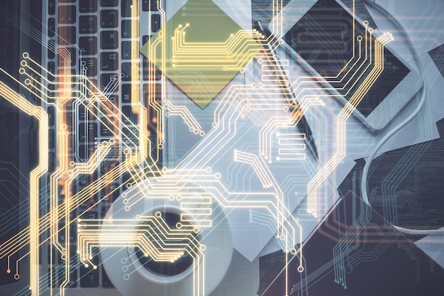 Holograma de tecnología dibujando sobre la computadora en el fondo del escritorio Vista superior Concepto tecnológico de doble exposición