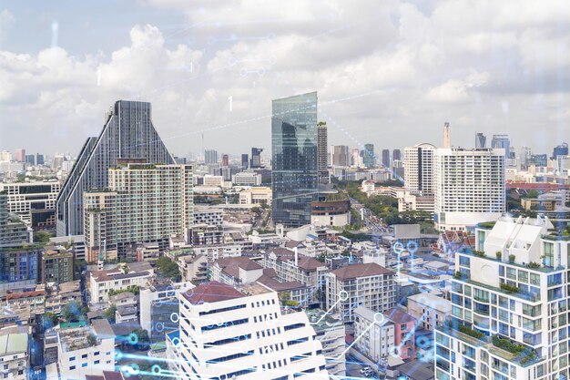 Holograma tecnológico sobre la vista panorámica de la ciudad de Bangkok El centro tecnológico más grande del sudeste asiático El concepto de desarrollo de codificación y ciencia de alta tecnología Exposición doble