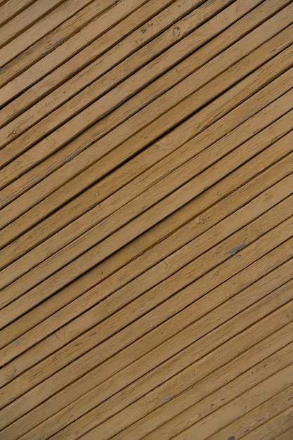 Holzbeschaffenheitshintergrund, schmutzige gelbe Farbe der hölzernen Planken Foto in hoher Qualität