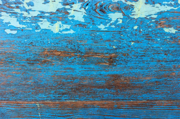 Foto holzhintergrund in blauer farbe im grunge-stil altes faules holzbrett