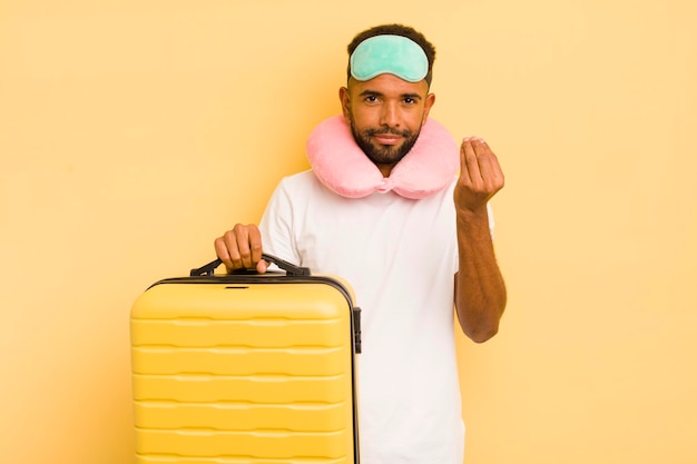 Hombre afro negro haciendo capice o gesto de dinero diciéndole que pague el concepto de vuelo de pasajeros