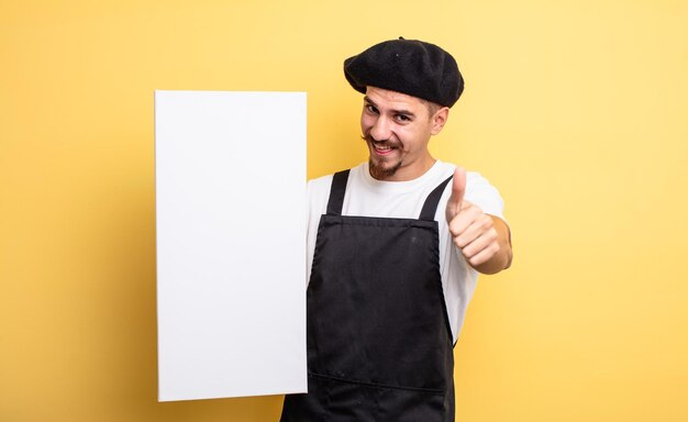 hombre artista que se siente orgulloso, sonriendo positivamente con los pulgares hacia arriba. concepto de espacio de copia