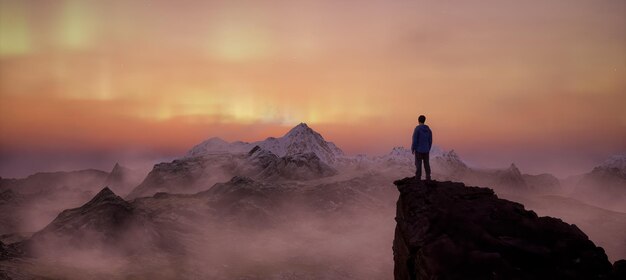 Hombre de aventuras en la cima del paisaje de las Montañas Rocosas