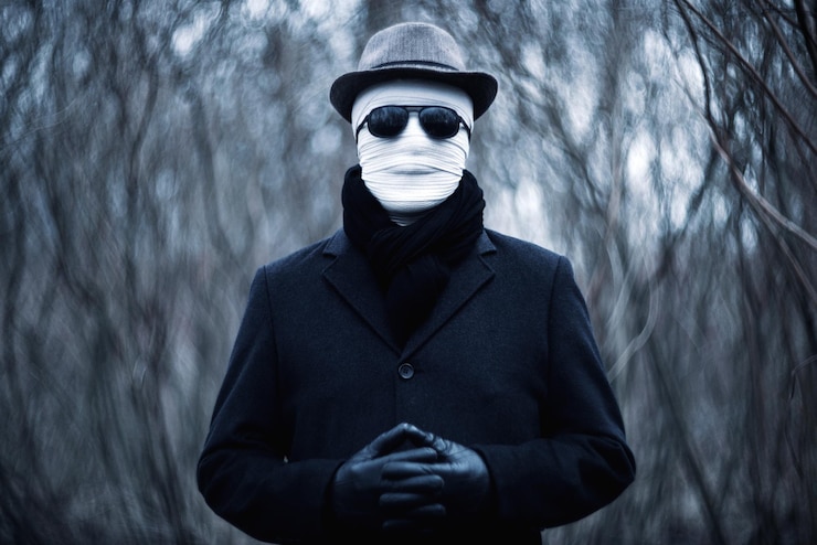 Foto un hombre elegante con una cara vendada