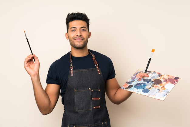 Foto hombre guapo joven sosteniendo una paleta