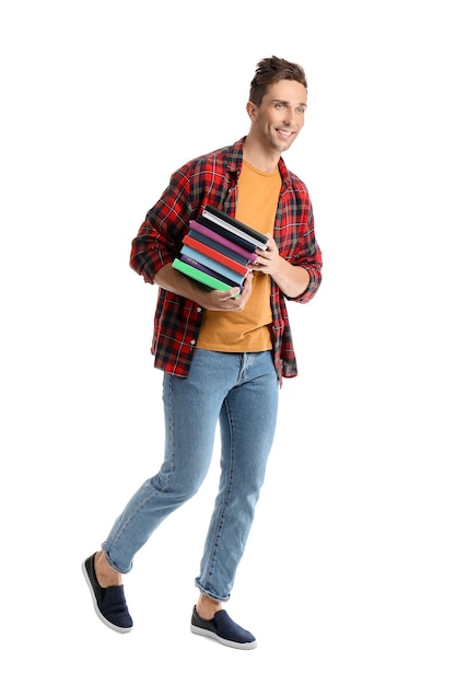 Foto hombre joven guapo con libros en blanco