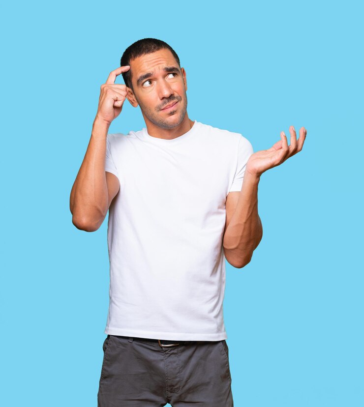 Foto hombre joven preocupado haciendo un gesto de confusión
