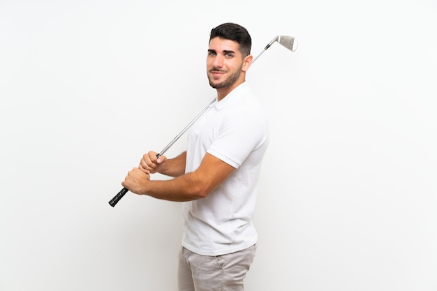 Foto hombre de jugador de golfista joven guapo en blanco