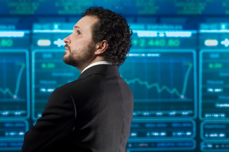 Foto hombre de negocios con barba y traje negro en el mercado de valores, atrás