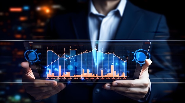 hombre de negocios sosteniendo una mesa con una pantalla virtual de gráficos infográficos