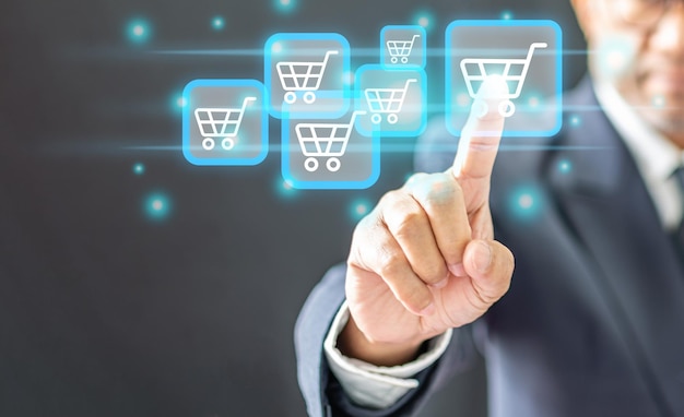 hombre de negocios tocando el símbolo del botón del carrito de compras concepto en línea hombre persona propietario del negocio con traje de dedo haga clic en el icono en la pantalla virtual para conectar tecnología internet para comprar en línea con comercio electrónico