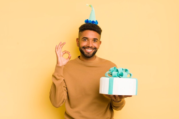 Homem afro negro se sentindo feliz mostrando aprovação com o conceito de aniversário de gesto bem