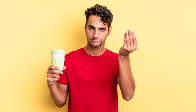 Homem bonito hispânico fazendo gesto capice ou dinheiro, dizendo para você pagar. take away conceito de café