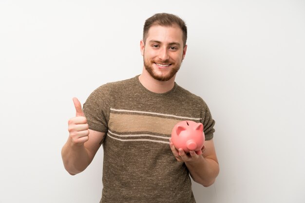 Homem bonito, segurando um grande piggybank