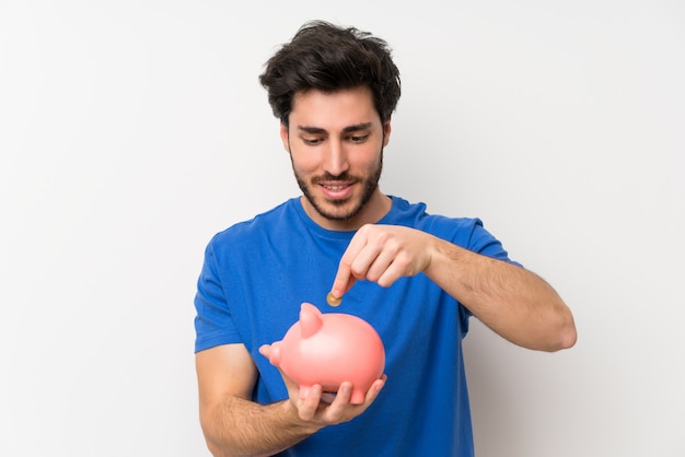 Homem bonito, segurando um grande piggybank