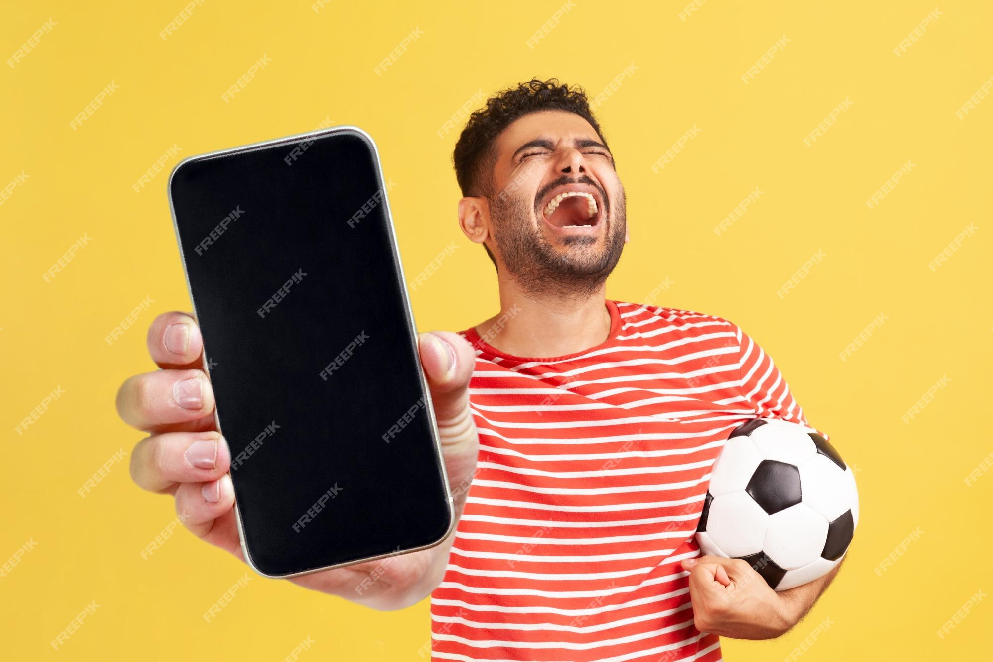 Fotos de Celular futebol, Imagens de Celular futebol sem royalties