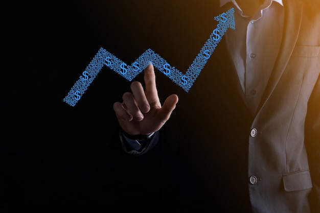 Homem de empresário segurando um gráfico com crescimento de lucros positivos. planejar o crescimento do gráfico e aumentar os indicadores positivos do gráfico em seu negócio.mais lucrativo e em crescimento.