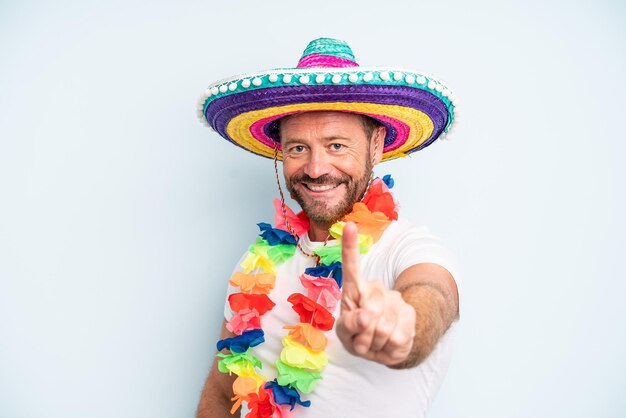 Homem de meia idade sorrindo com orgulho e confiança fazendo o número um. cultura mexicana