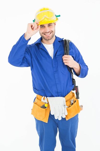 Foto homem de reparo feliz que usa um capacete amarelo