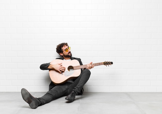 Foto homem jovem bonito músico