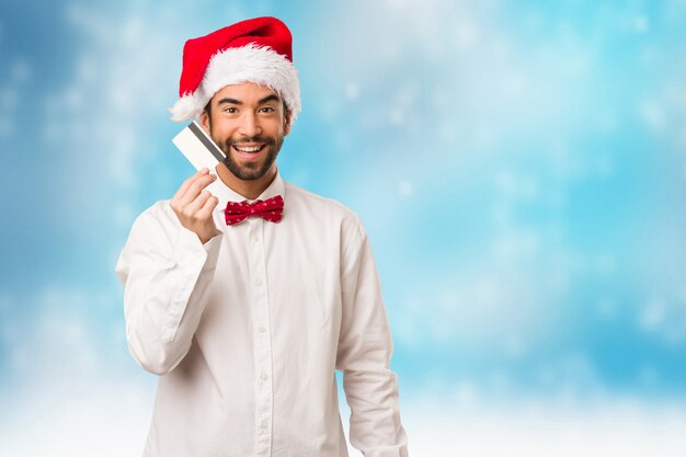 Homem jovem, desgastar, um, papai noel, chapéu, ligado, dia natal