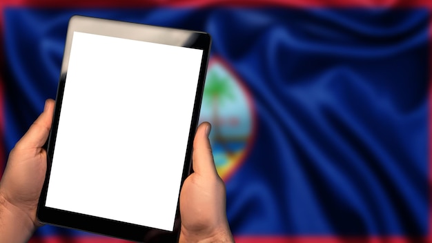 Foto homem segura tablet pc bandeira do país de guam no fundo