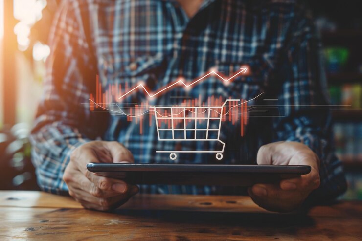 Homem segura um tablet com um carrinho de compras Conceito de compras na Internet
