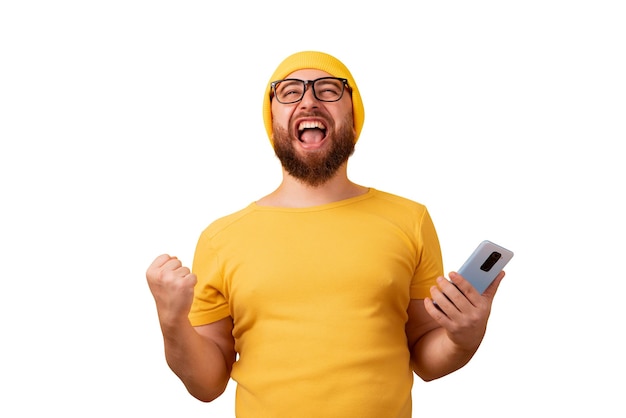 Foto homem vencedor com telefone isolado em fundo branco